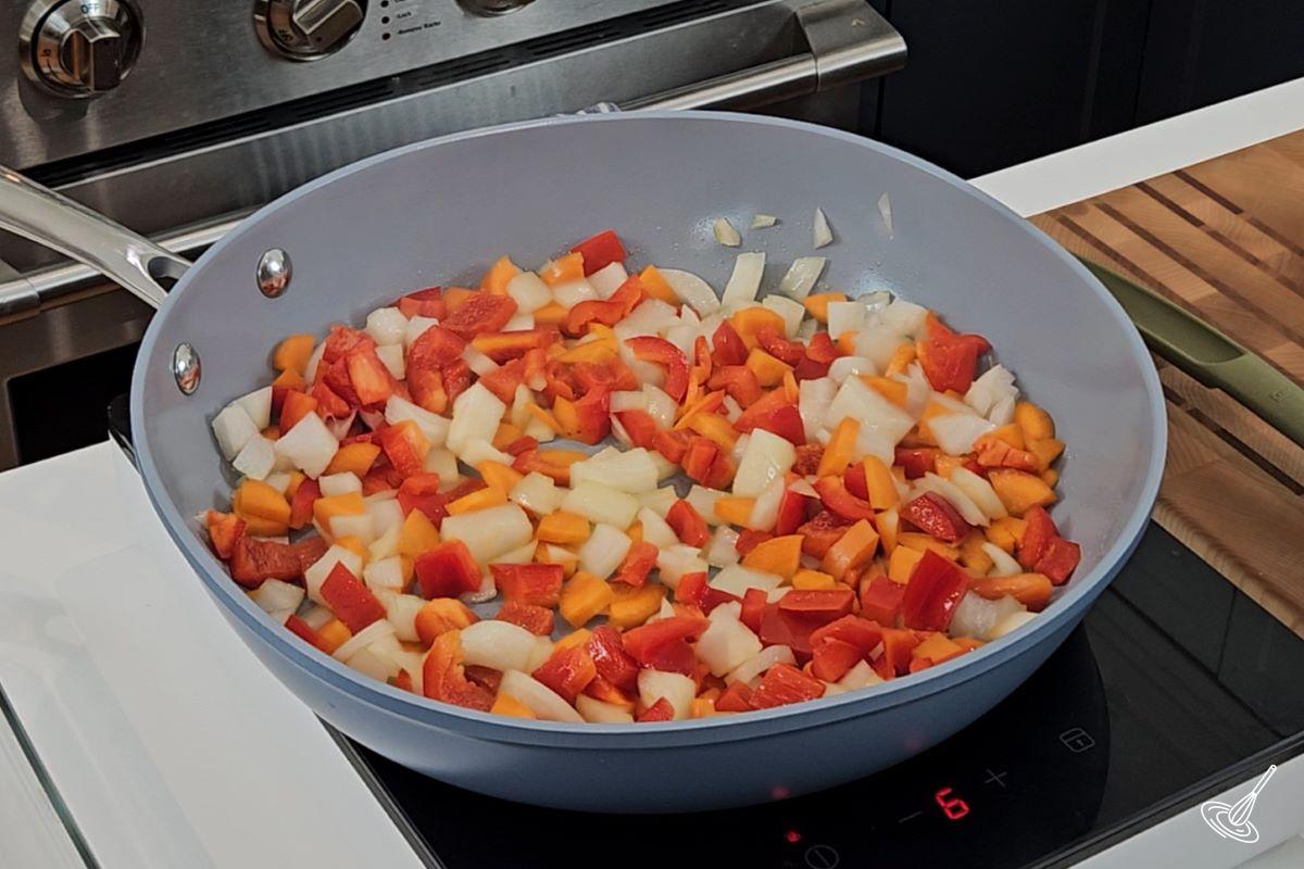 Chopped vegetables in a large frying pan. 