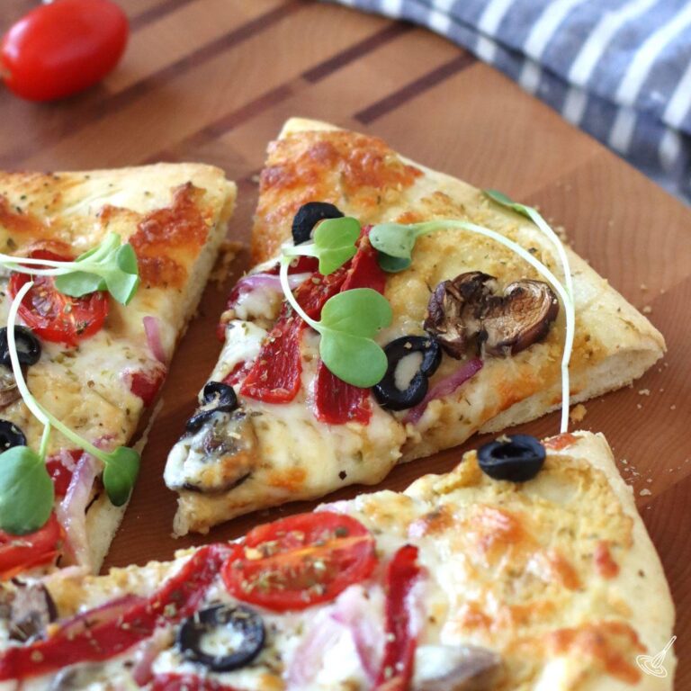 A slice of hummus pizza