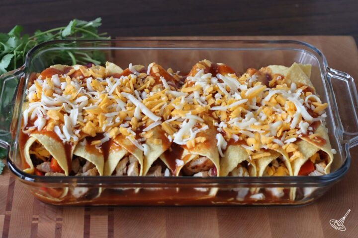 A leftover turkey enchiladas casserole before going into the oven.