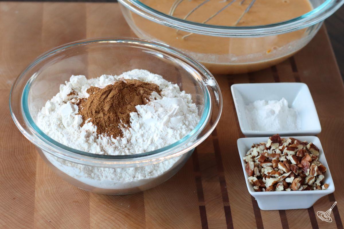 A small bowl containing flour, cinnamon and baking powder.