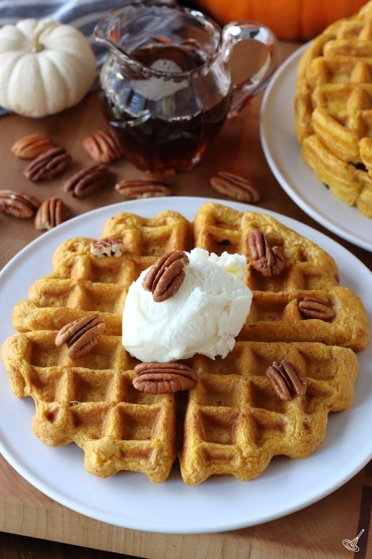 Pumpkin Pecan Waffles on a plate.