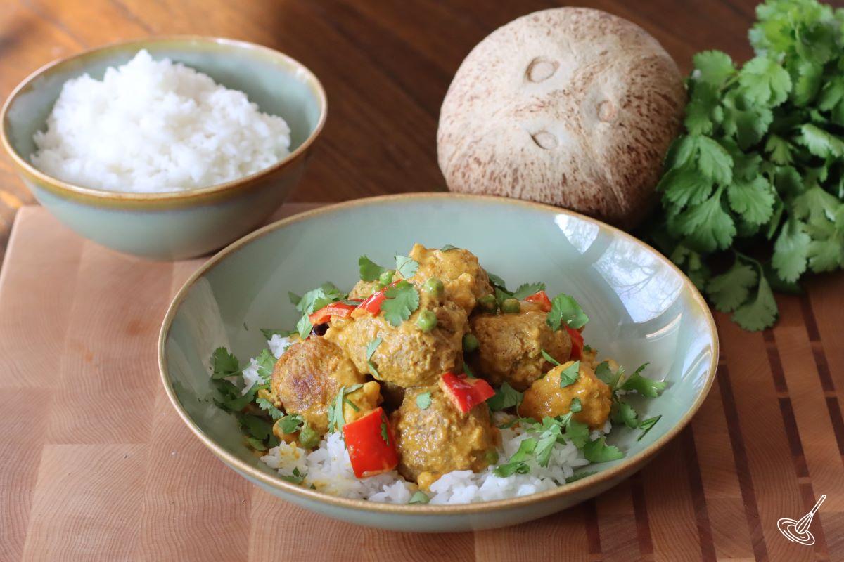 Coconut Curry Meatballs served over rice. 