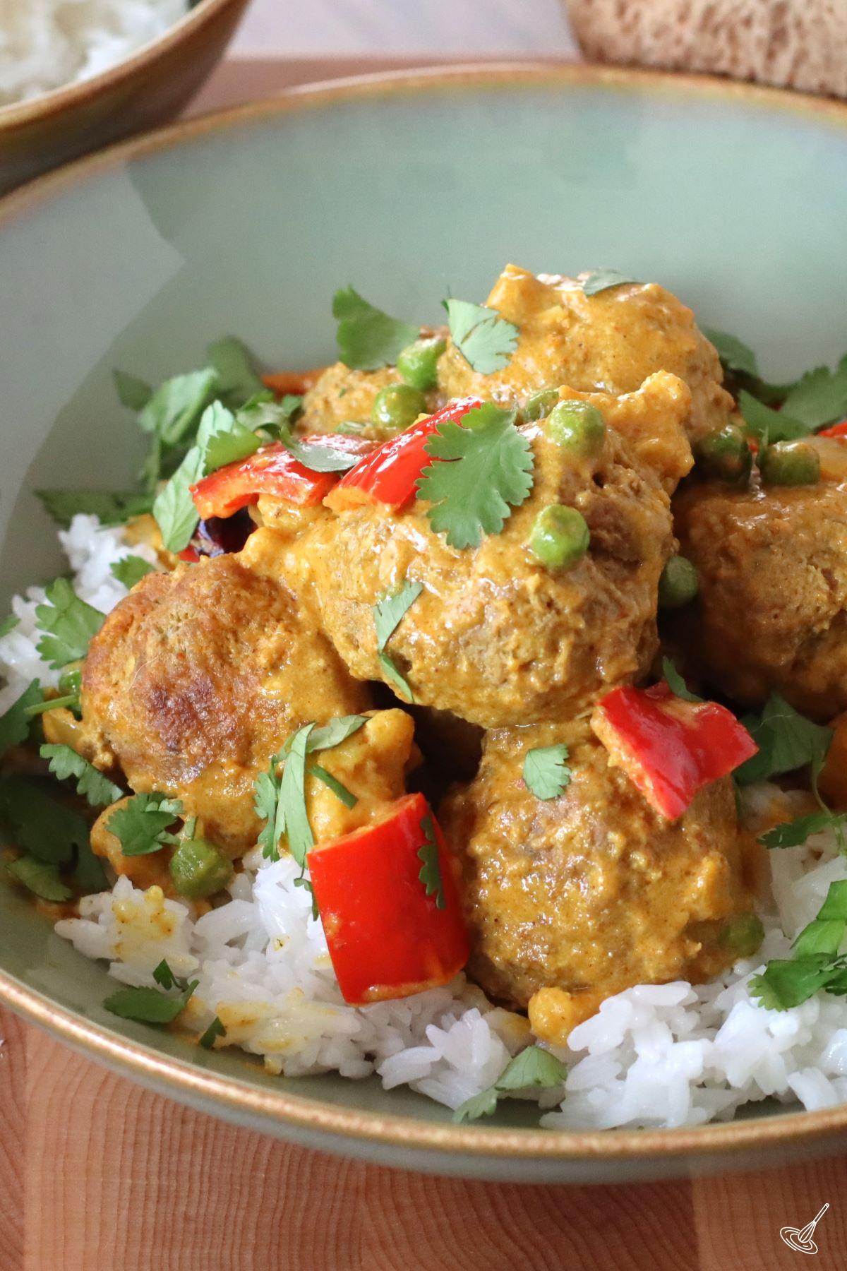 Coconut Curry Meatballs served over rice.