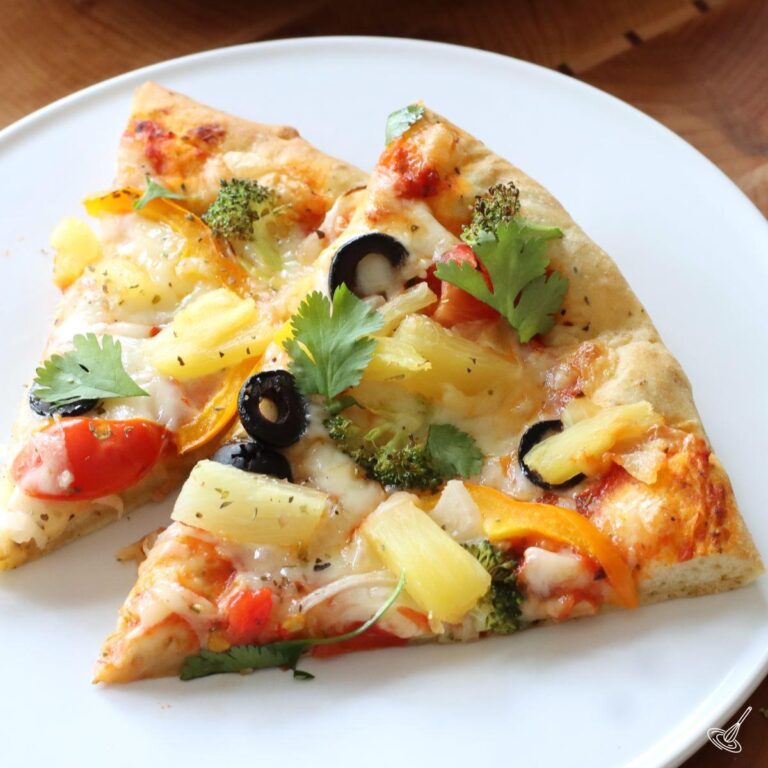 Veggies Pizza with Pineapple on a plate.
