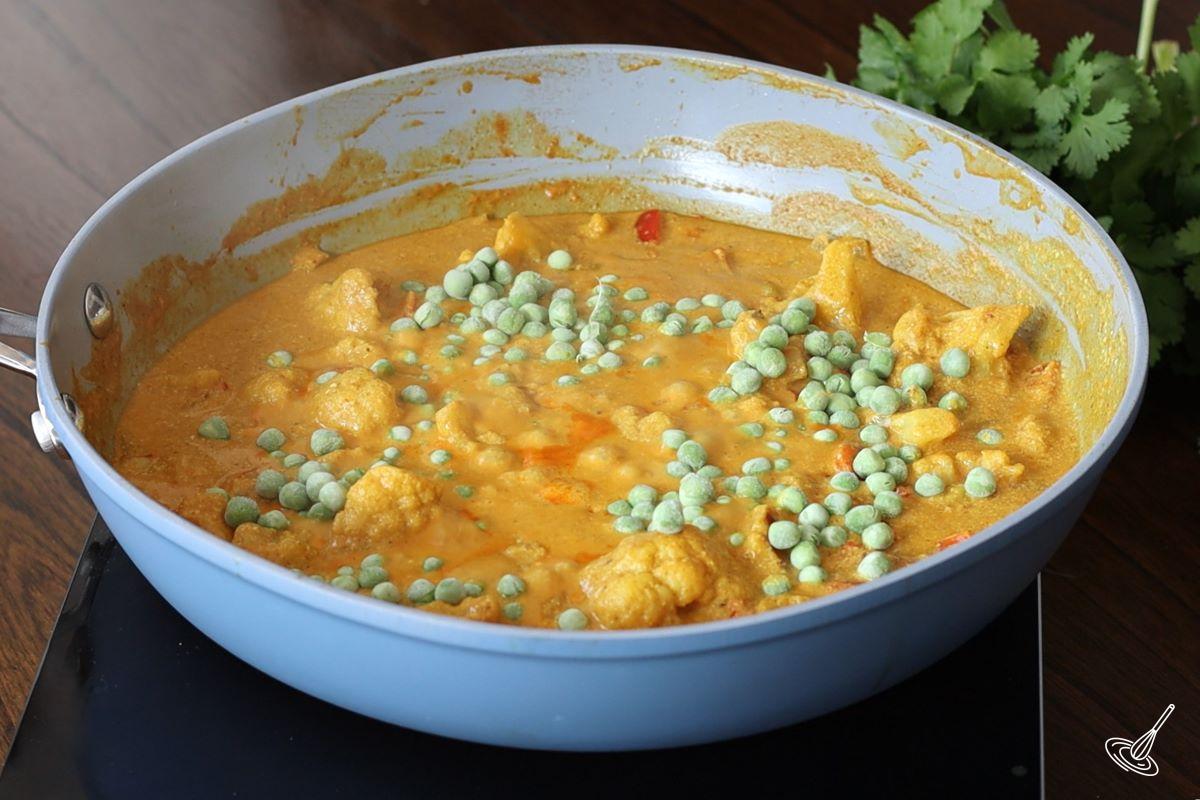 A vegetable curry coconut sauce in a large frying pan.