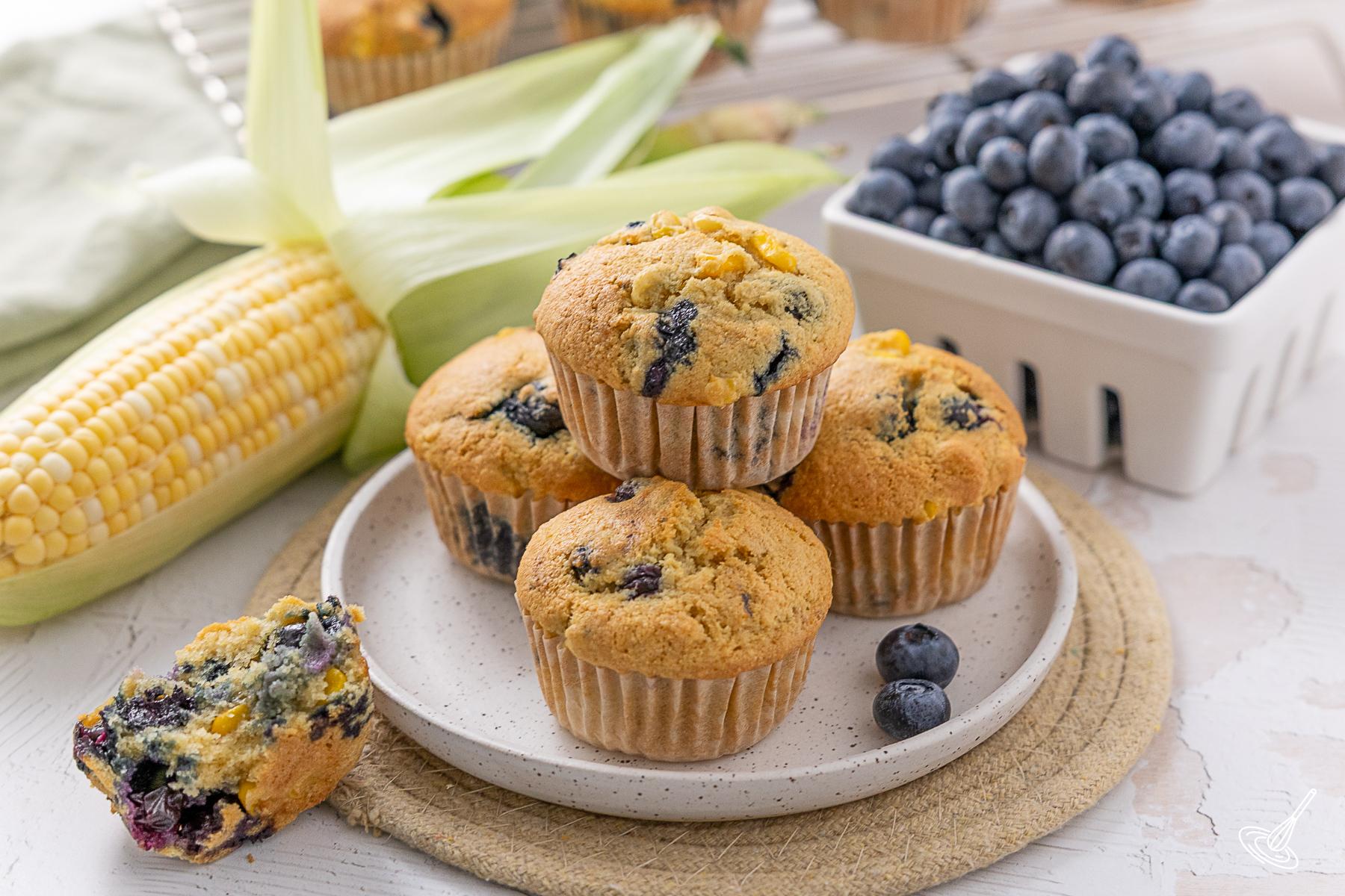 Blueberry Corn Muffins on a plate.