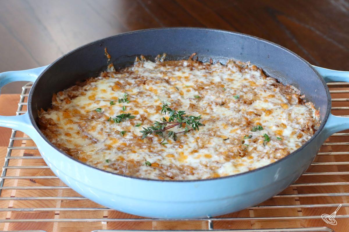 A skillet of cooked French Onion Soup Rice.