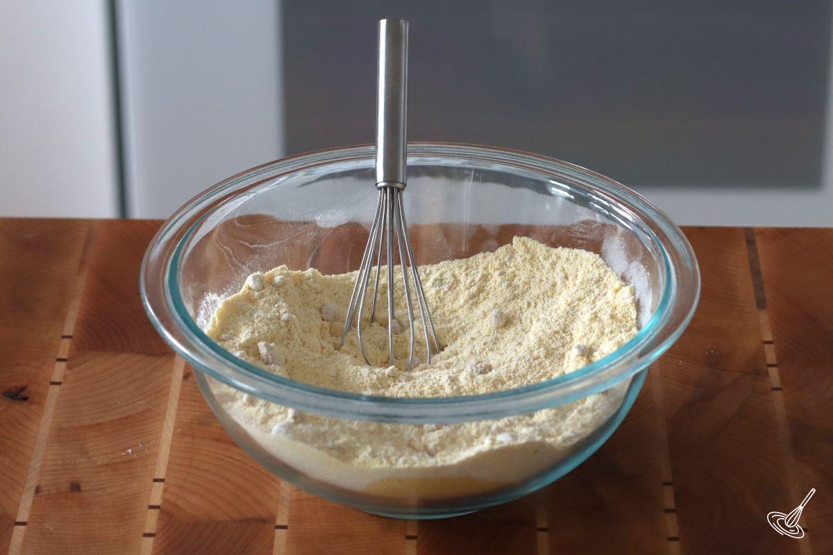 A bowl of dry ingredients for cornbread.