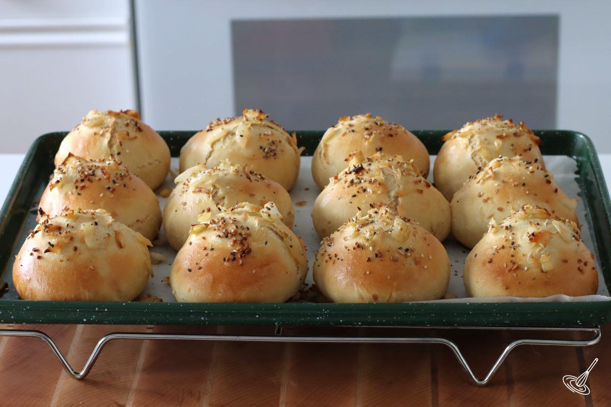 Baked Soft Onion Rolls on a tray.