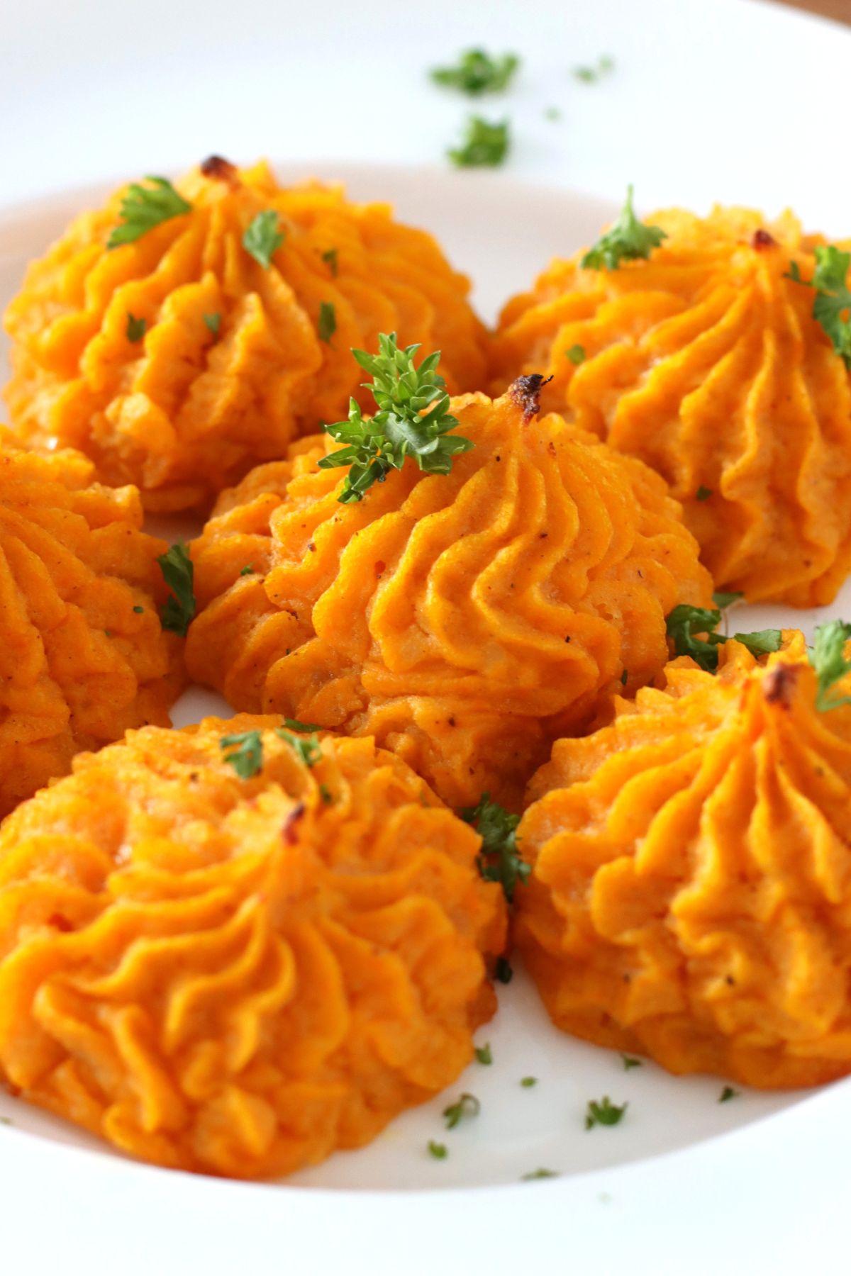 Duchess Sweet Potatoes on a plate. 