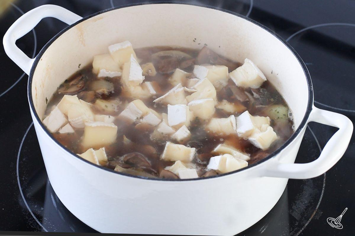 Mushroom and Brie Soup in a soup pot. 
