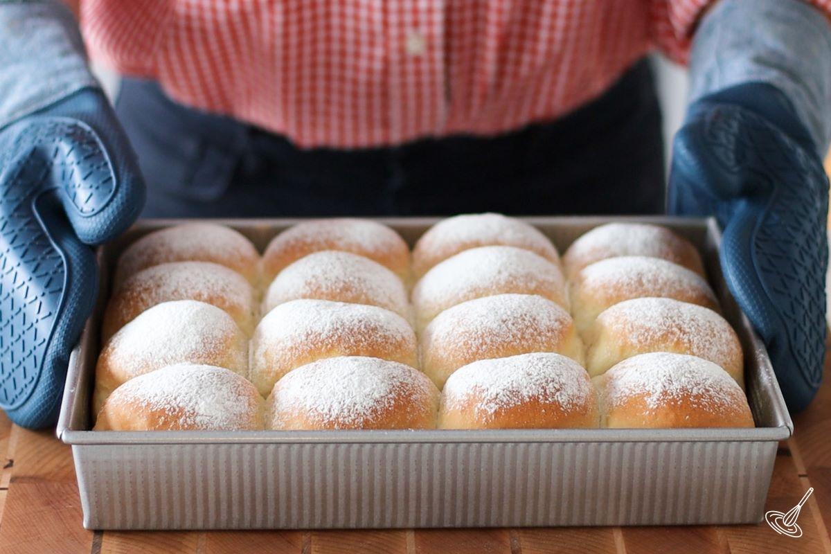 A baking dish of Snowflake Dinner Rolls.