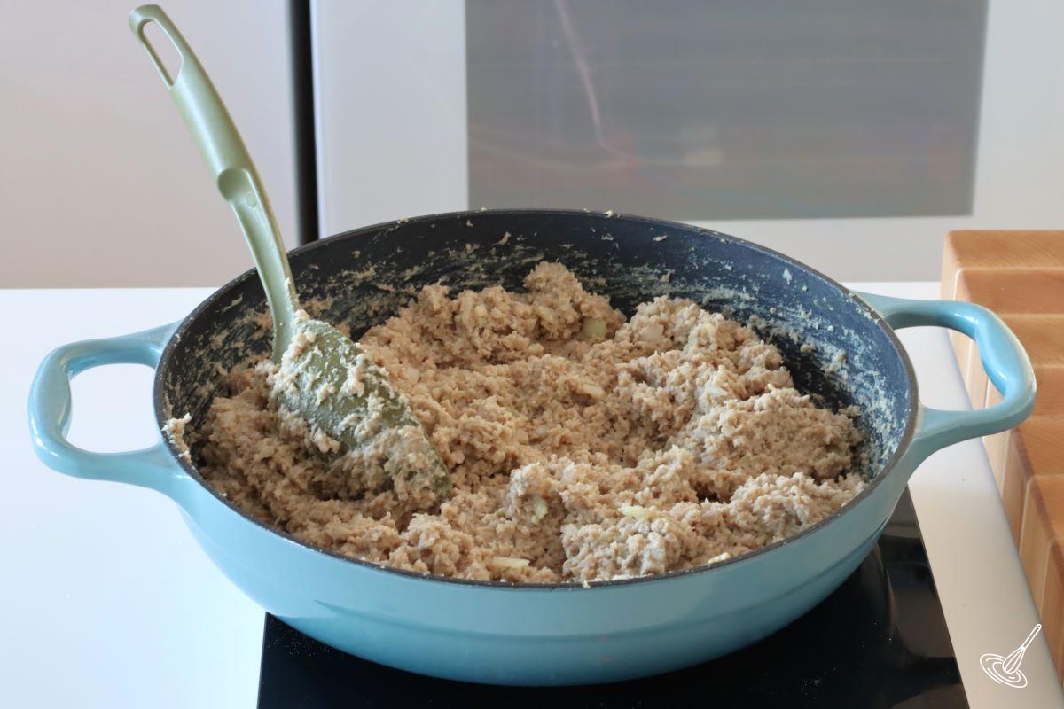 A cooked cretons recipe in a large skillet.