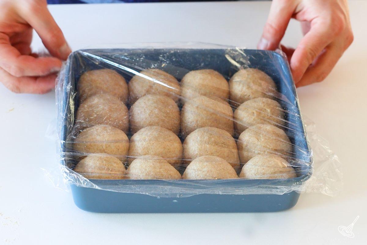 Einkorn Dinner Rolls proofing in a baking dish.