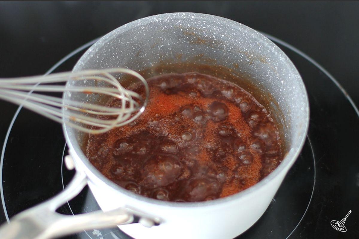 A Maple BBQ sauce simmering in a small saucepan. 