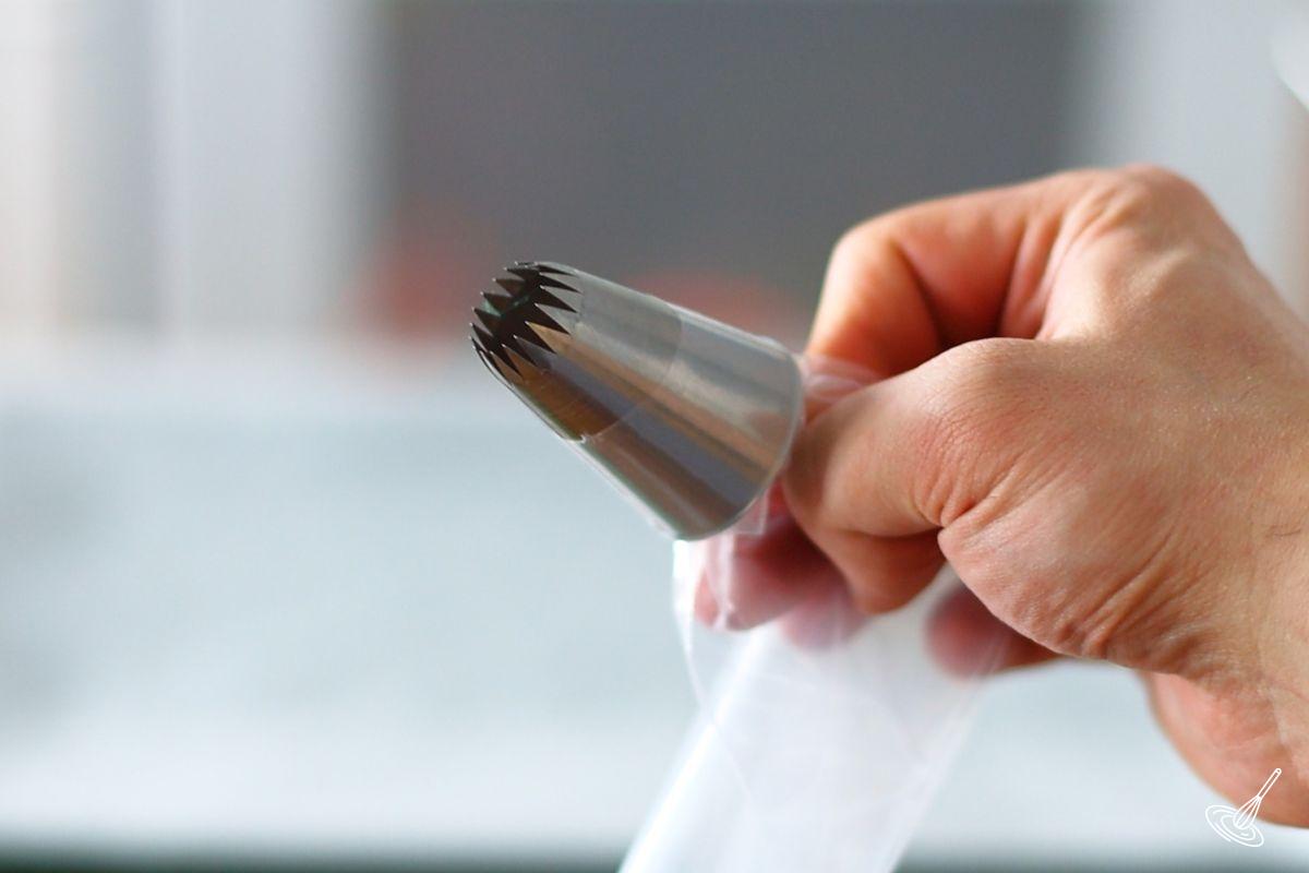 A piping bag with a large star tip. 