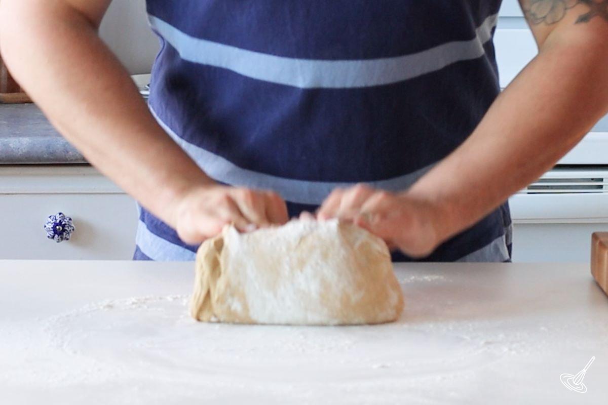 Someone kneading the dough for Einkorn Dinner Rolls.