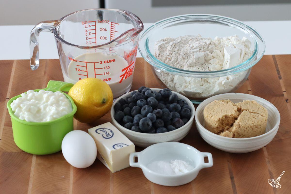 Ingredients for Cottage Cheese Blueberry Muffins including flour, milk, and cottage cheese.