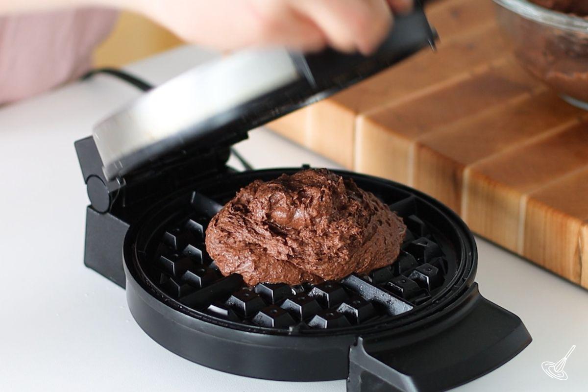 Chocolate Cottage Cheese Waffles batter in a waffle iron before being cooked.