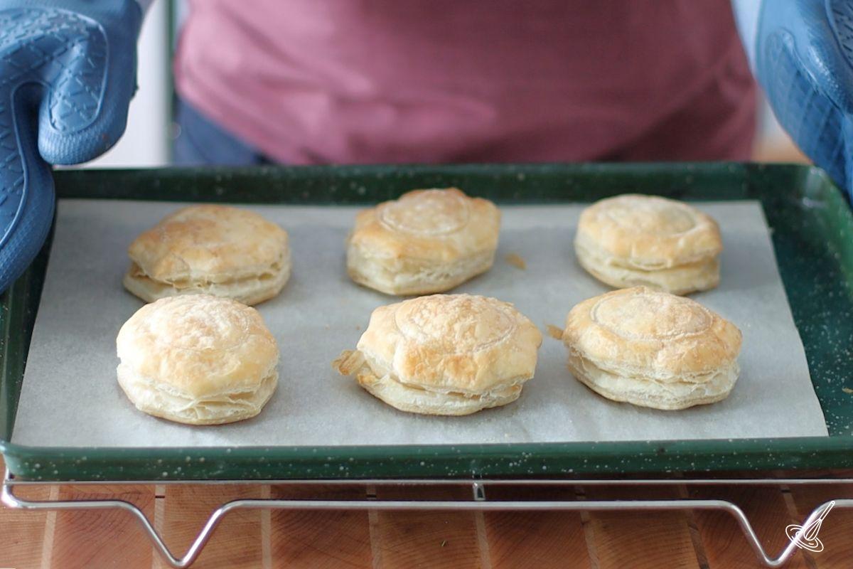 Baked Vol-au-Vent shells on a baking tray.