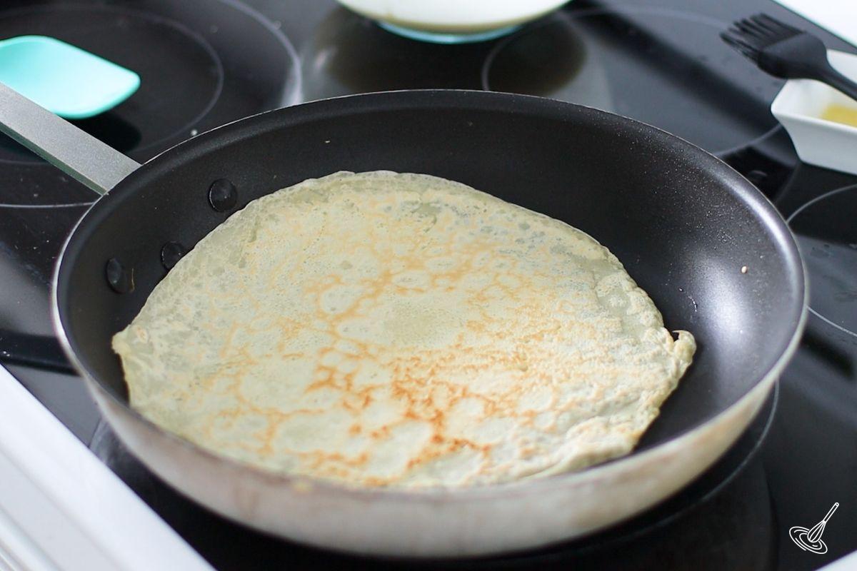 A cooked Pâte à Crêpes in a frying pan.