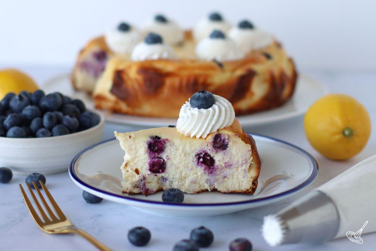 A slice of blueberry basque cheesecake on a plate.