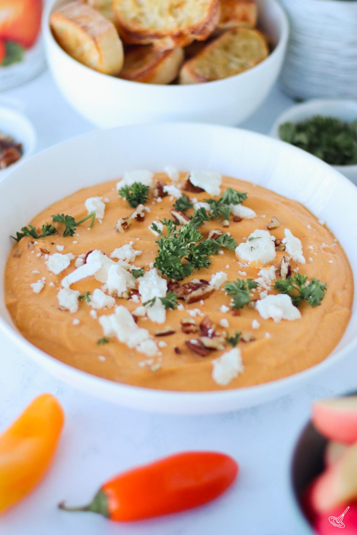 Pumpkin Whipped Feta Dip in a serving bowl.