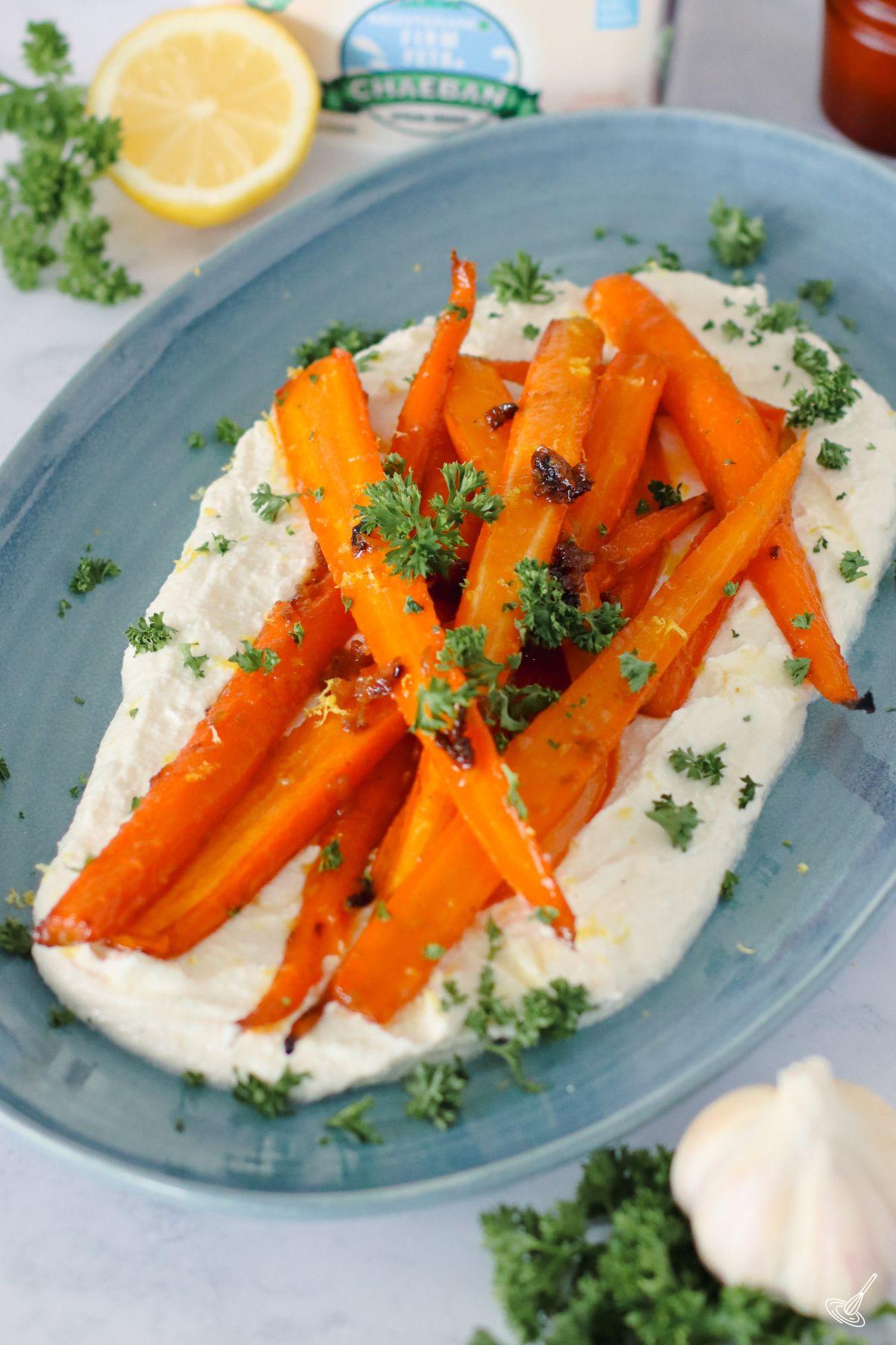 Roasted Carrots with whipped feta on a platter.