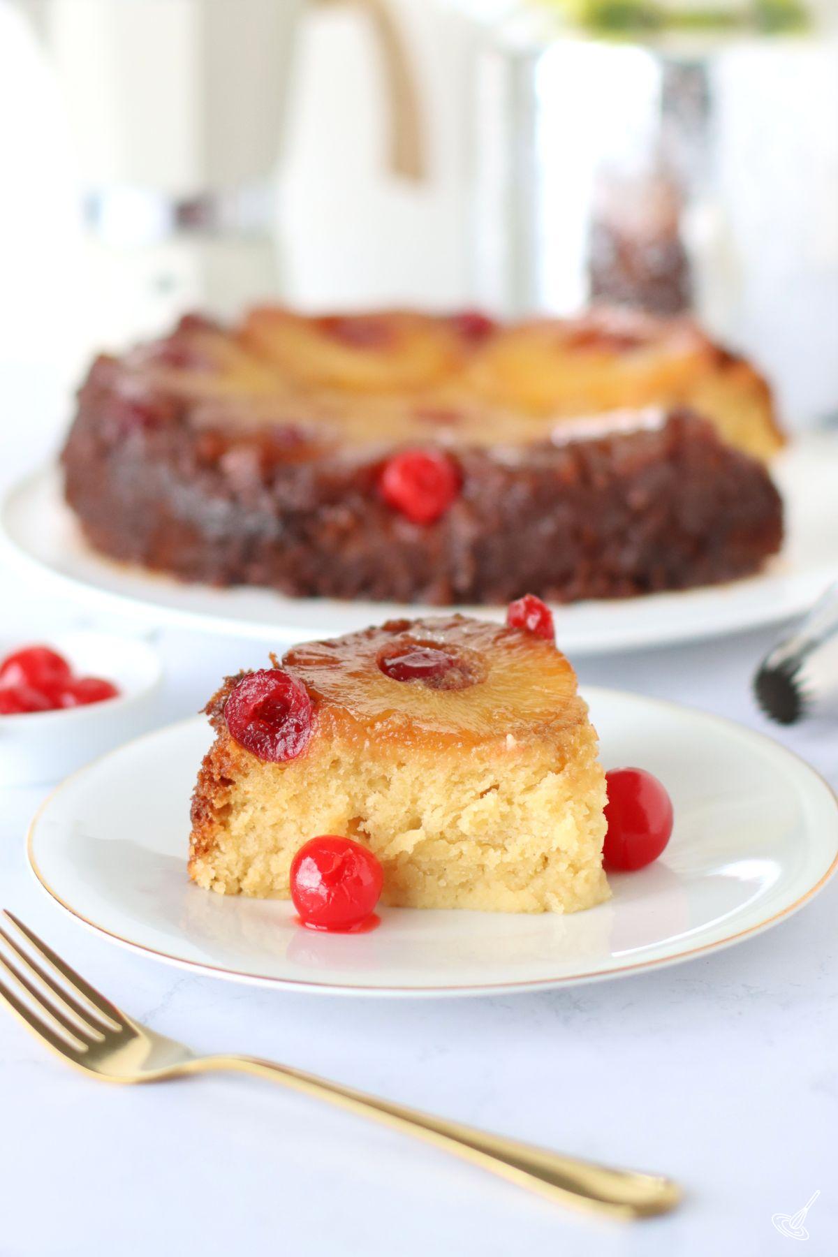 A slice of Crockpot Pineapple Upside Down Cake on a plate.