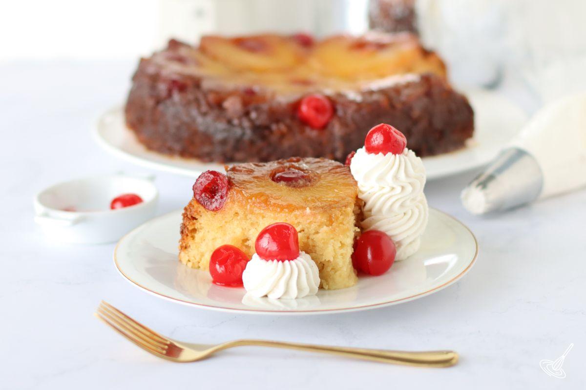 A slice of Crockpot Pineapple Upside Down Cake on a plate.