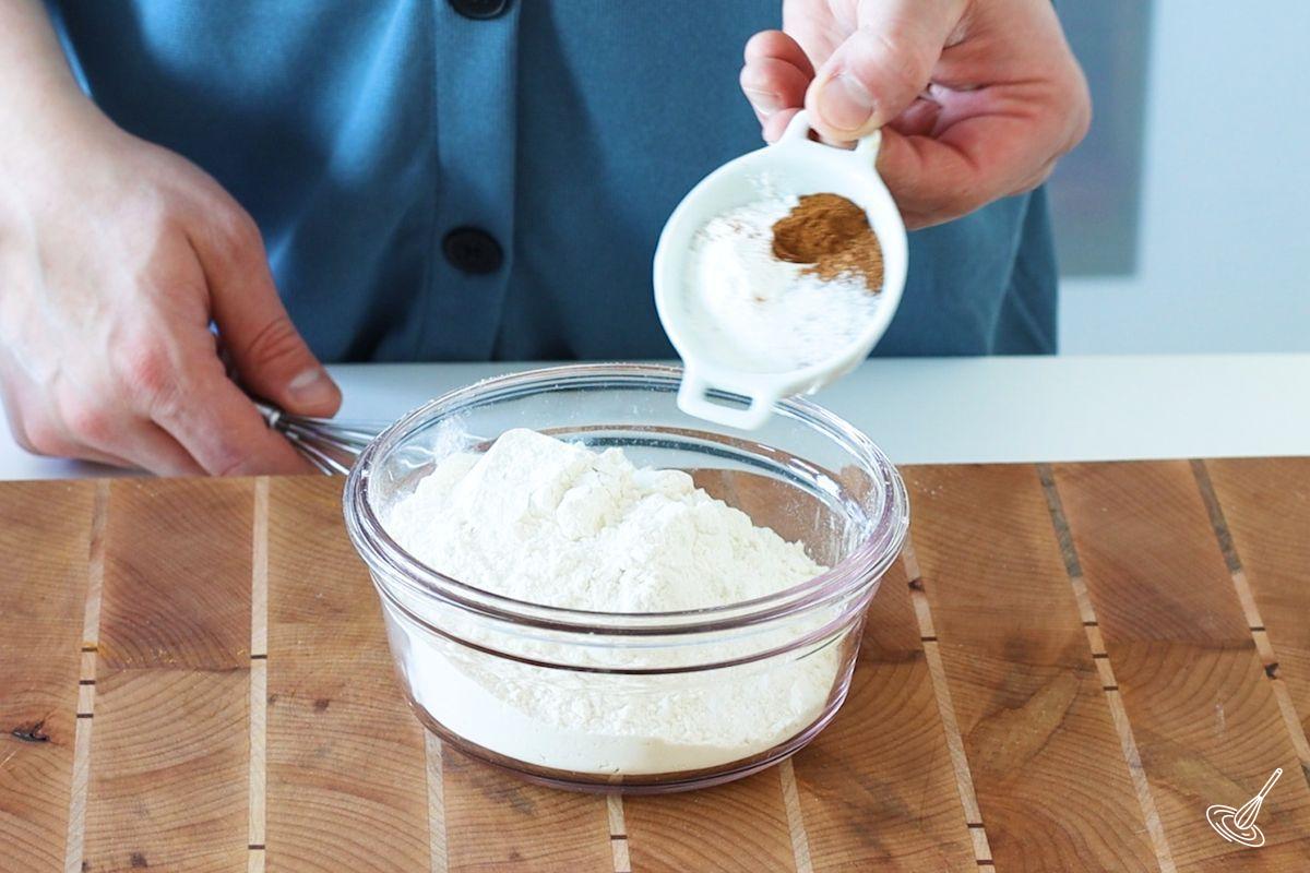 Someone whisking together dry baking ingredients. 
