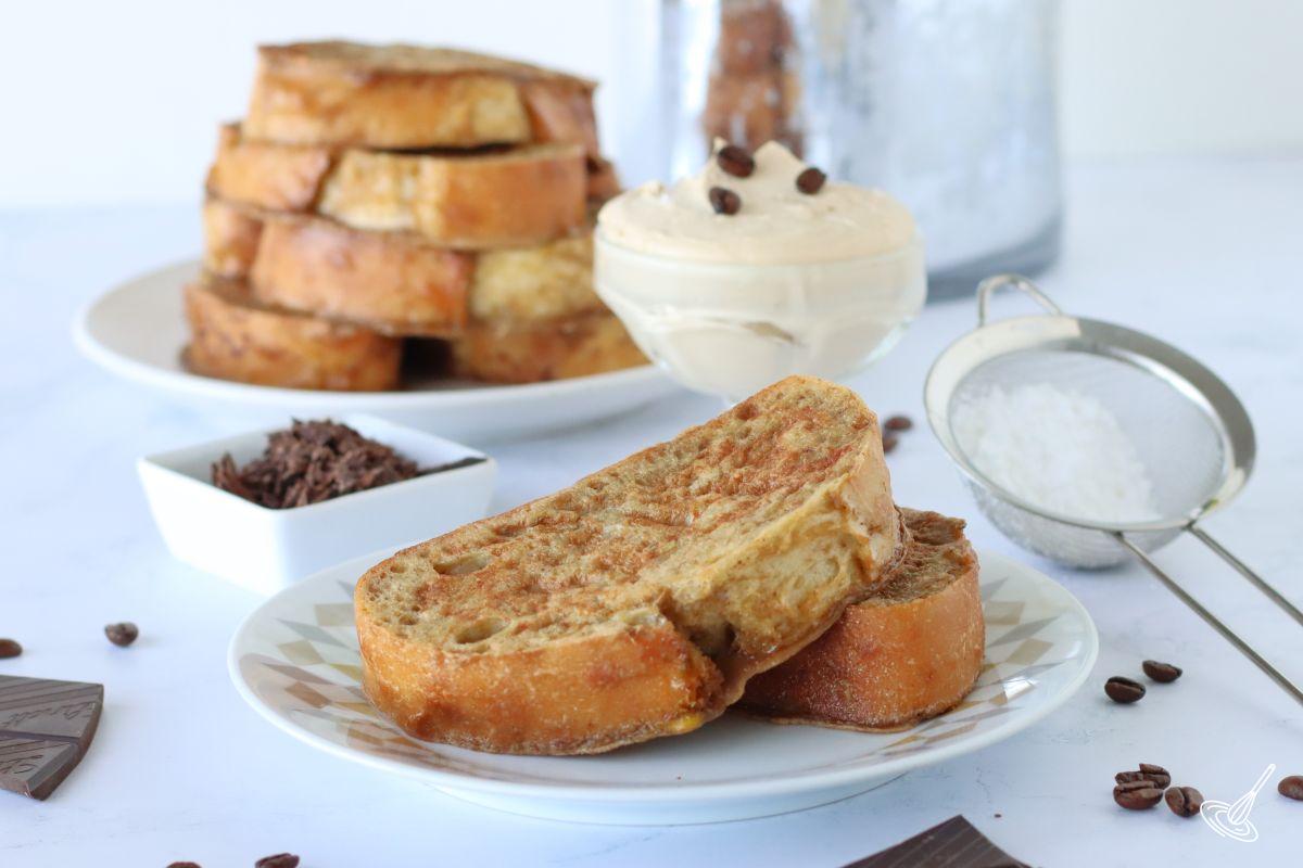 Two slices of Tiramisu french toast on a plate.