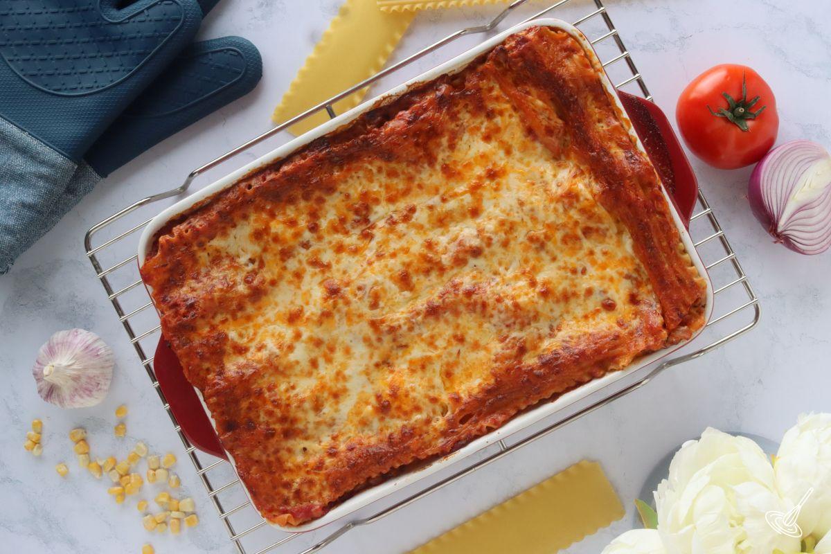 A cooked Barbecue Turkey Lasagna resting on a cooling rack. 
