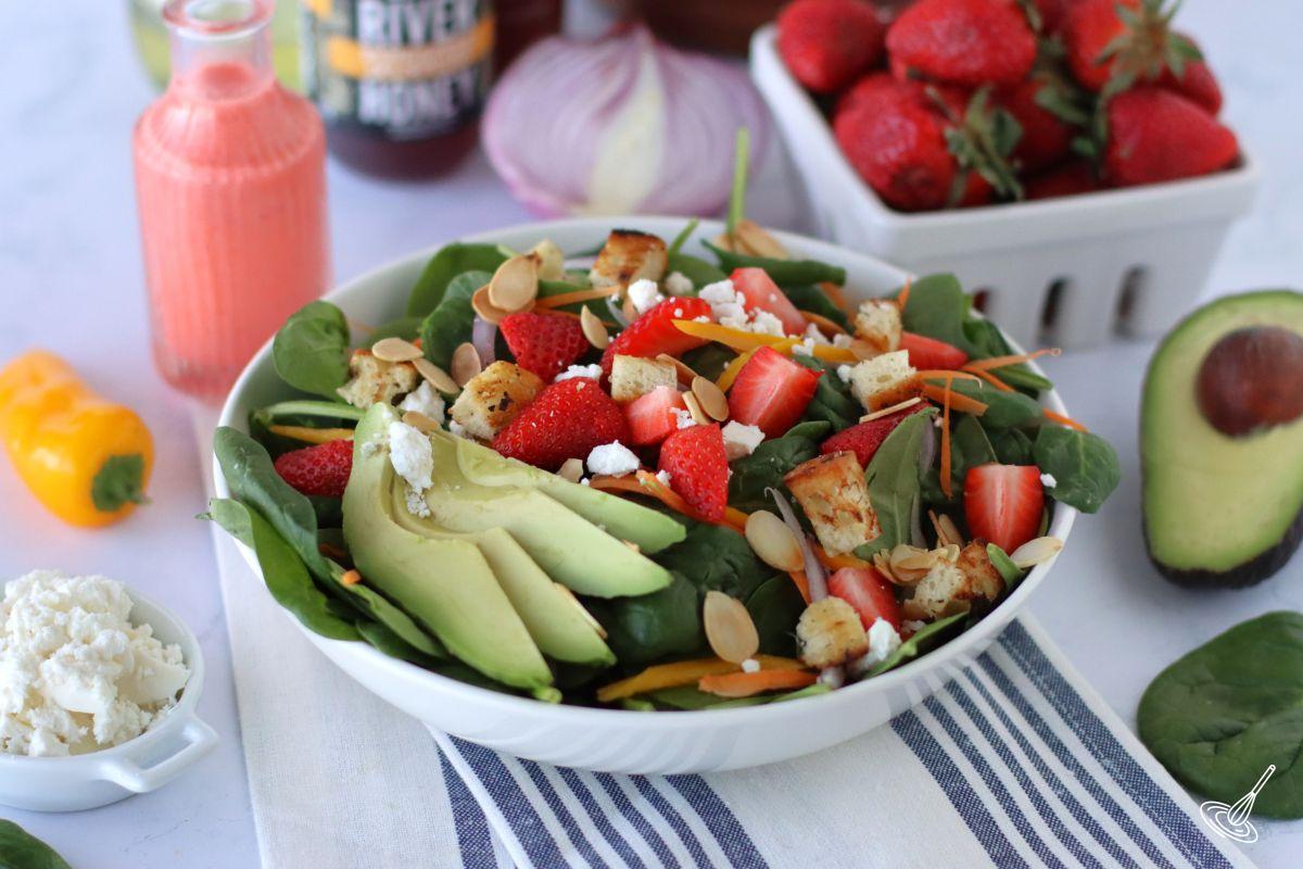 Strawberry Dressing Spinach Salad in a bowl. 
