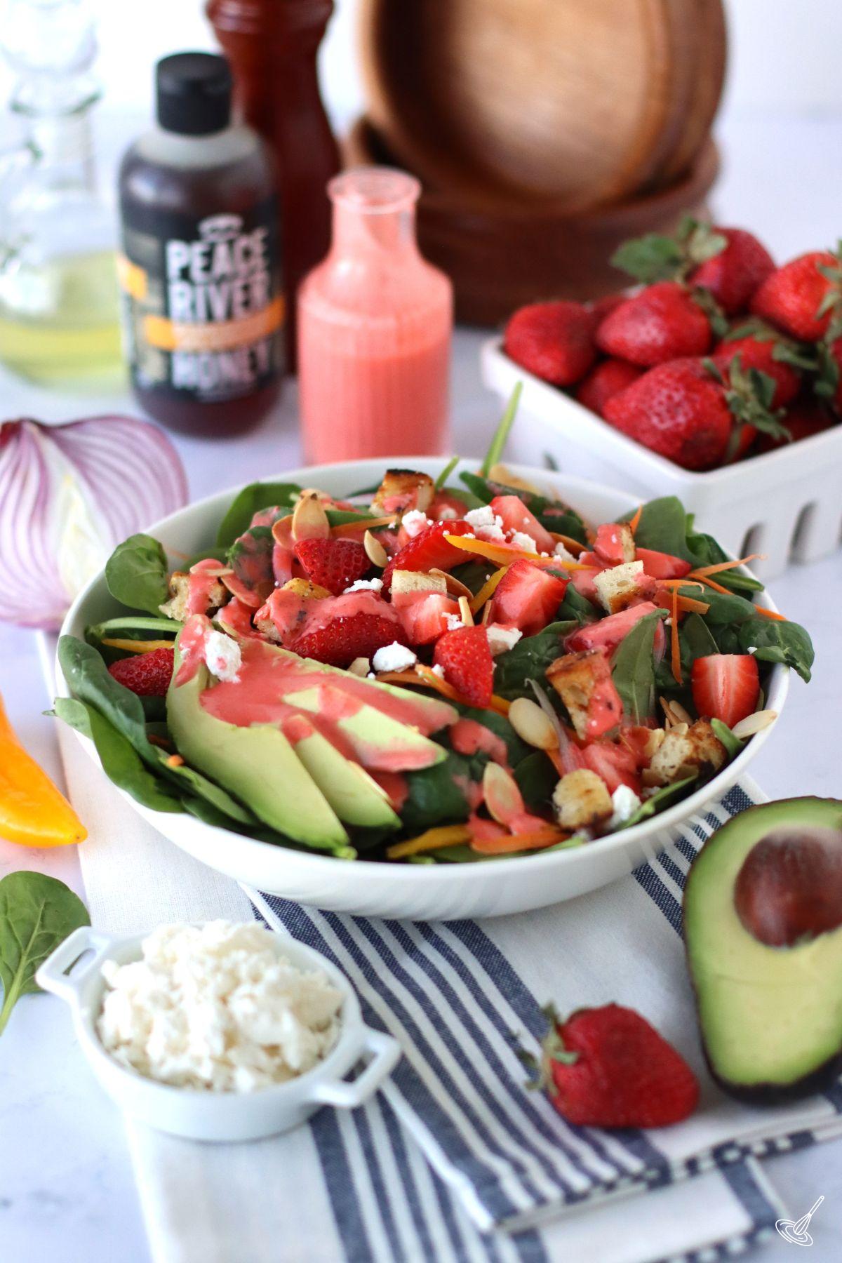 Strawberry Dressing Spinach Salad in a bowl. 