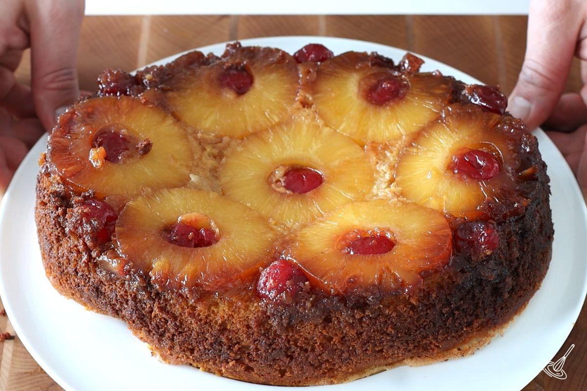 A Crockpot Pineapple Upside Down Cake on a plate.