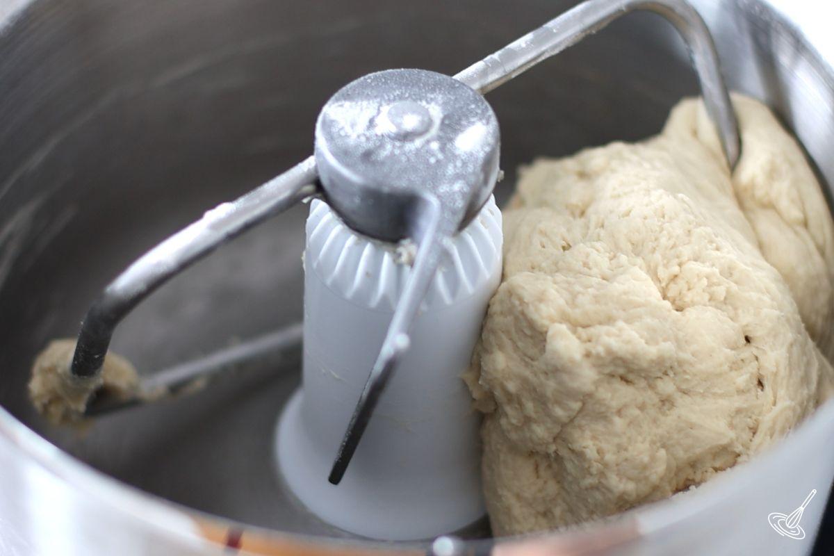 A recipe of brioche sub roll mixing in a stand mixer. 