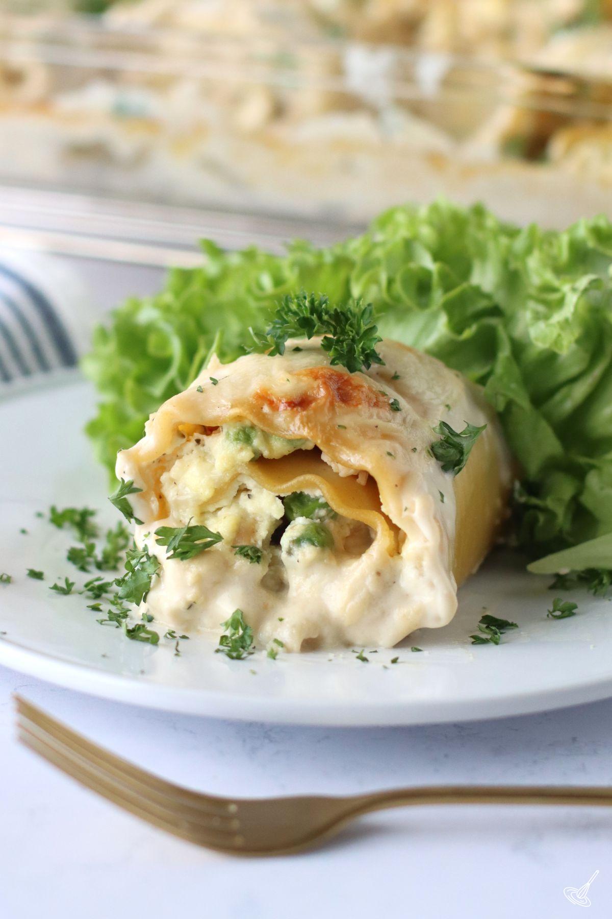 Turkey Alfredo Lasagna Rollups on a plate.