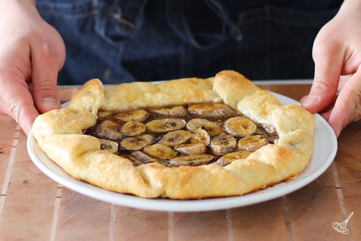 A baked Banana Chocolate galette on a white plate.