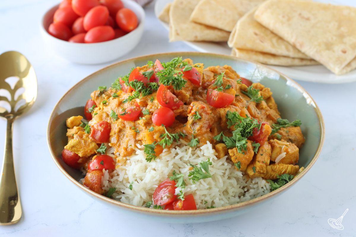 A bowl of Chicken Curry with buttermilk over rice. 