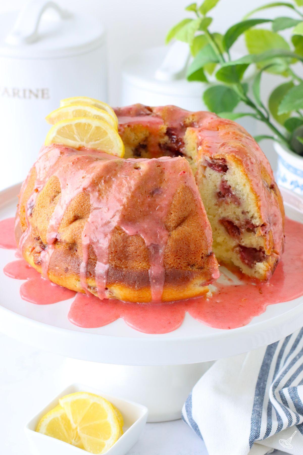Strawberry Lemonade Bundt Cake on a cake stand. 