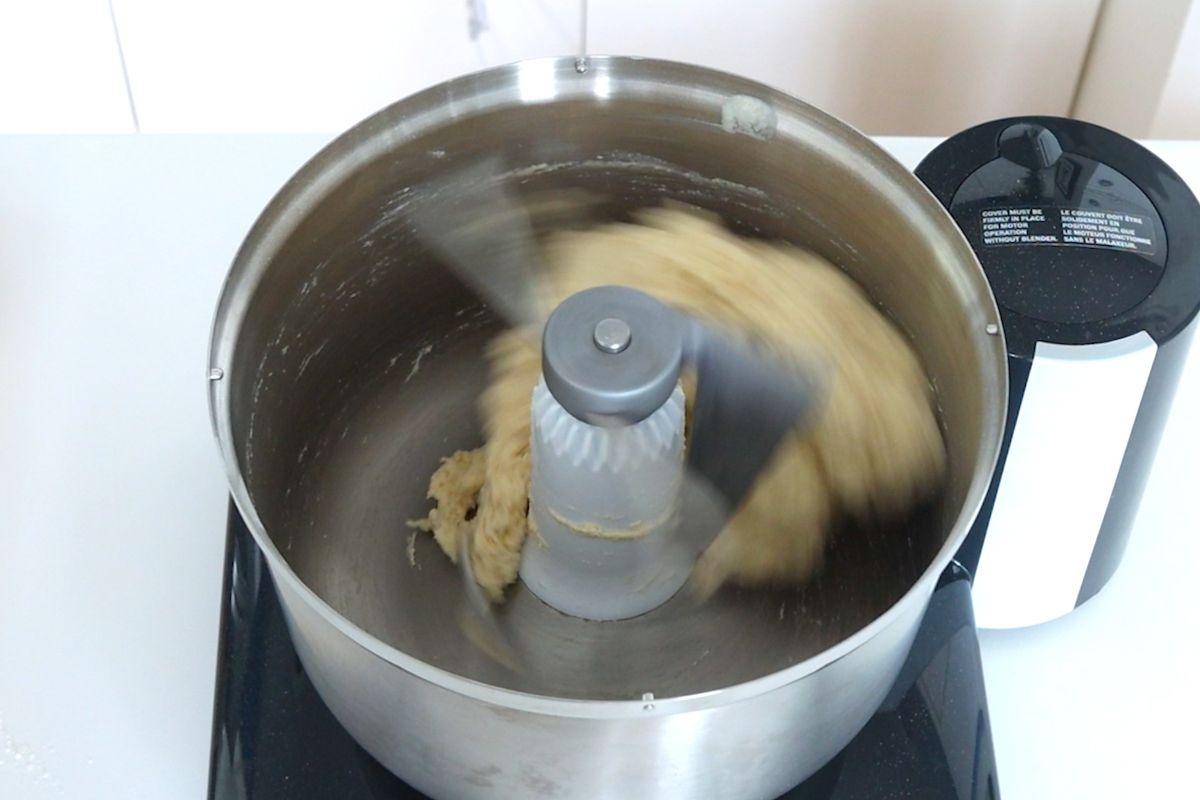 Pretzel slider buns dough mixing in a stand mixer. 