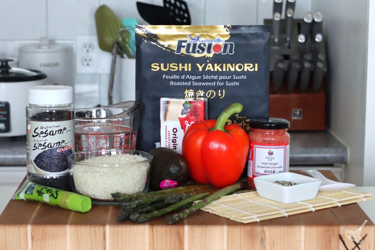 Ingredients on a cutting board to make Asparagus Roll Sushi. 
