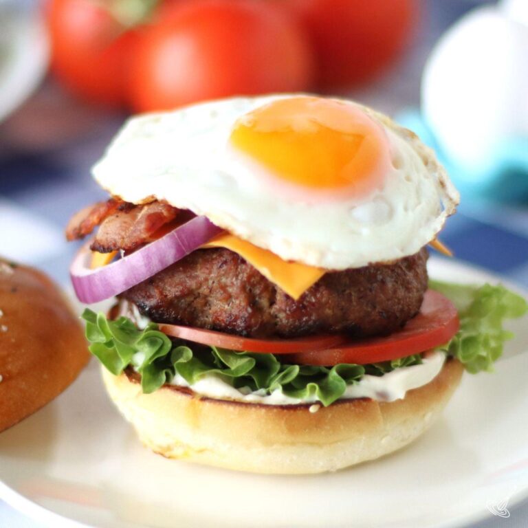 Bacon Egg Cheese Burger on a plate.