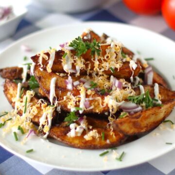 Loaded Potato Wedges on a plate.