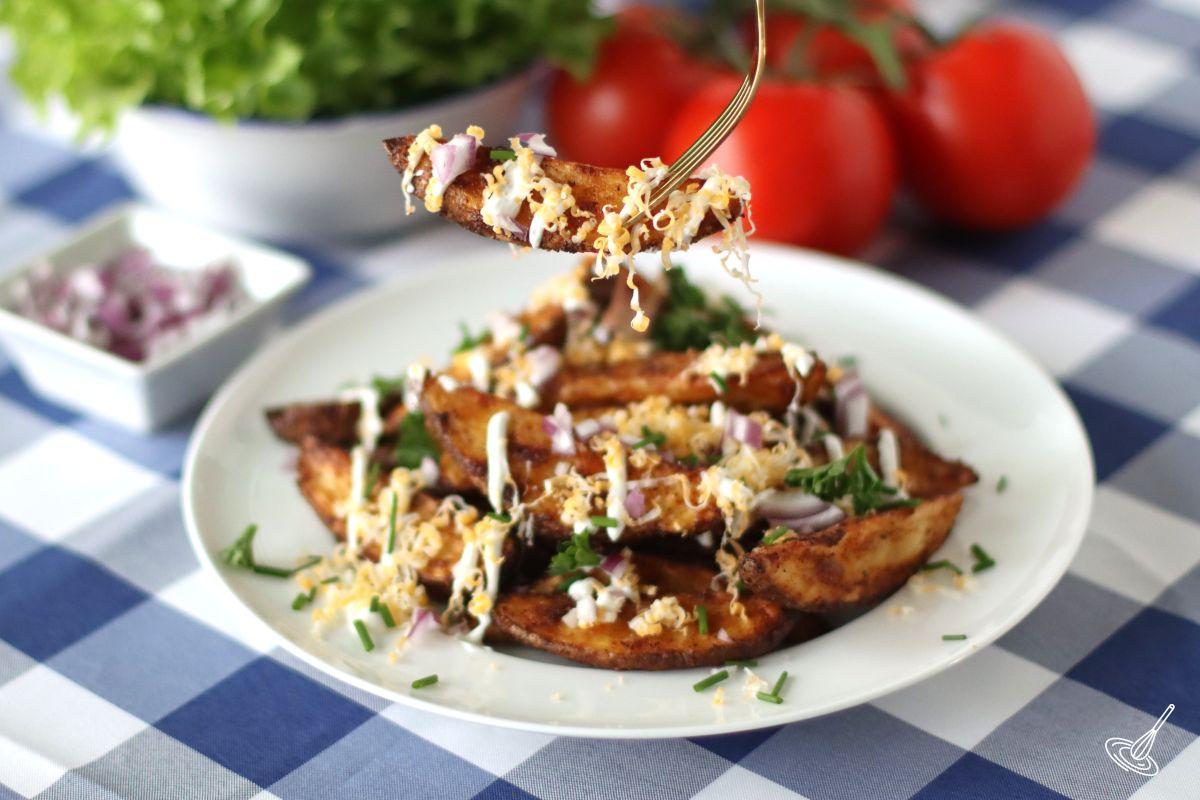 A plate of loaded potato wedges.