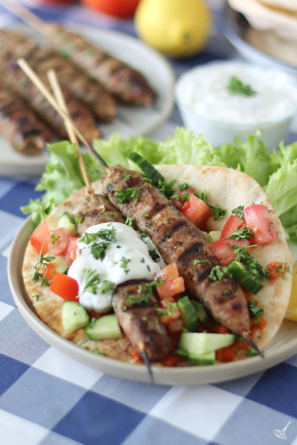 Ground Turkey Kofta Skewers on a pita bread. 