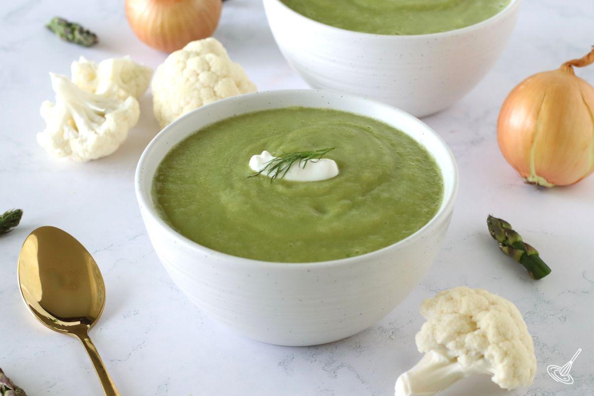 A bowl of cauliflower asparagus soup. 