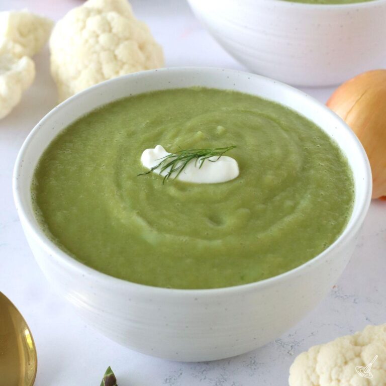 Creamy Asparagus Cauliflower Soup in a bowl.