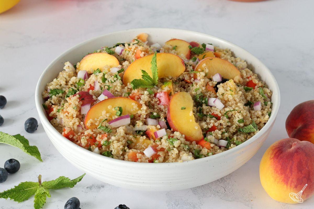 A Peach Quinoa Salad in a serving bowl.
